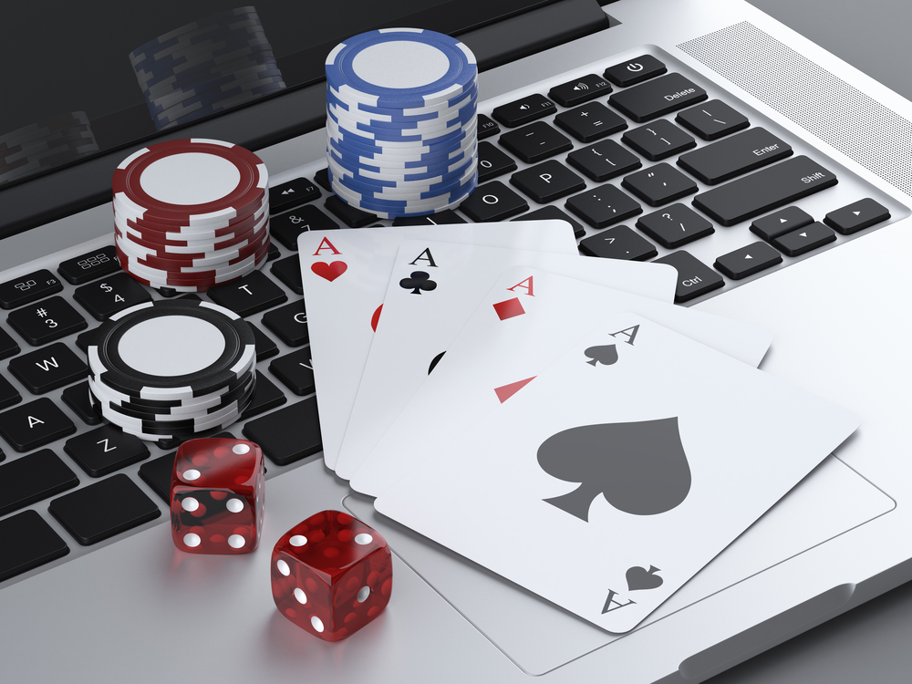 Laptop,With,Gambling,Chips,And,Poker,Cards